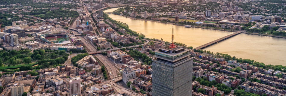 aerial view of boston skyline Under a sunset.