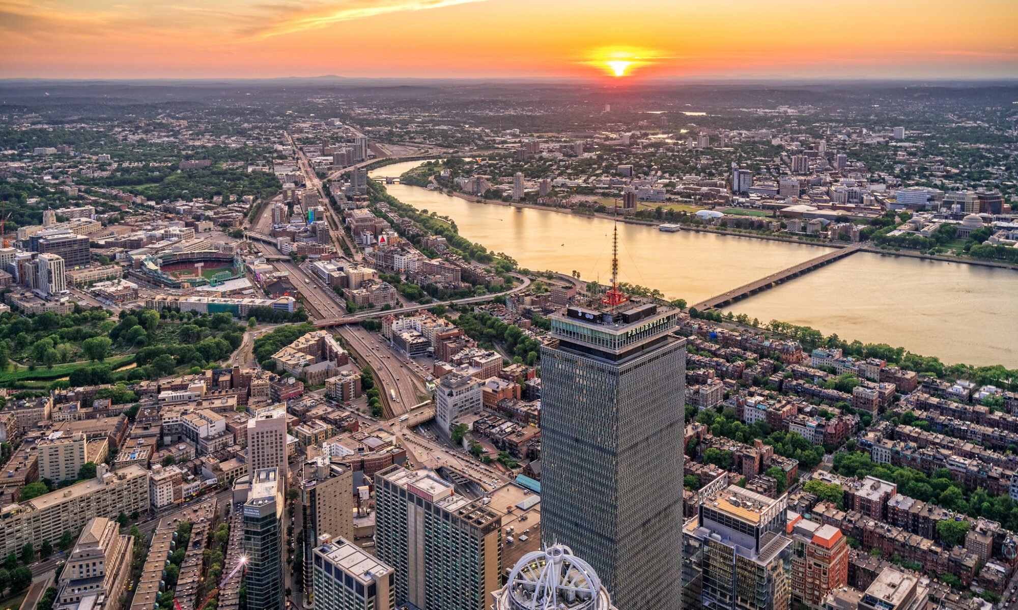 aerial view of boston skyline Under a sunset.