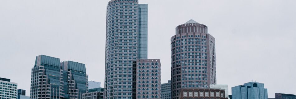 Image of the Boston Skyline. Blue and Brown Buildings on a cloudy Day.